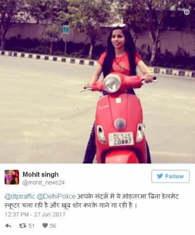 Dhinchak Pooja riding a scooter without helmet