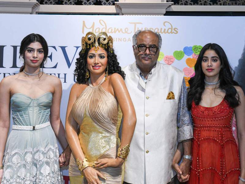 Janhvi, Khushi, and Boney Kapoor with a wax figurine of Sridevi at Madame Tussauds Singapore