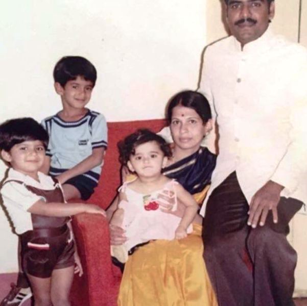 Childhood picture of Anushka Shetty (sitting in her mother's lap) with her family