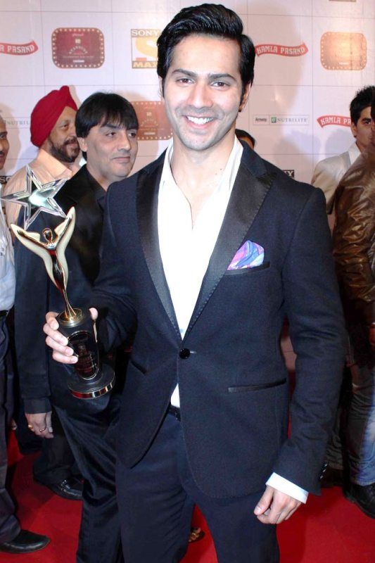 Varun Dhawan Posing With an Award