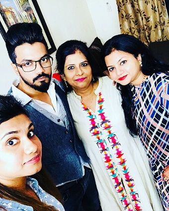 Rocky Jaiswal with his mother and two sisters
