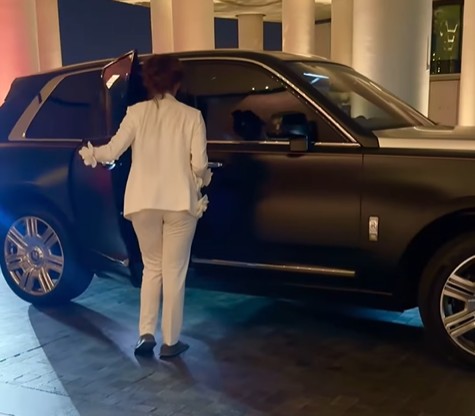 Urvashi Rautela standing next to her Rolls Royce