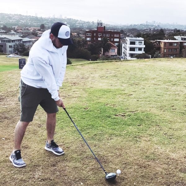 Nick Jonas playing golf