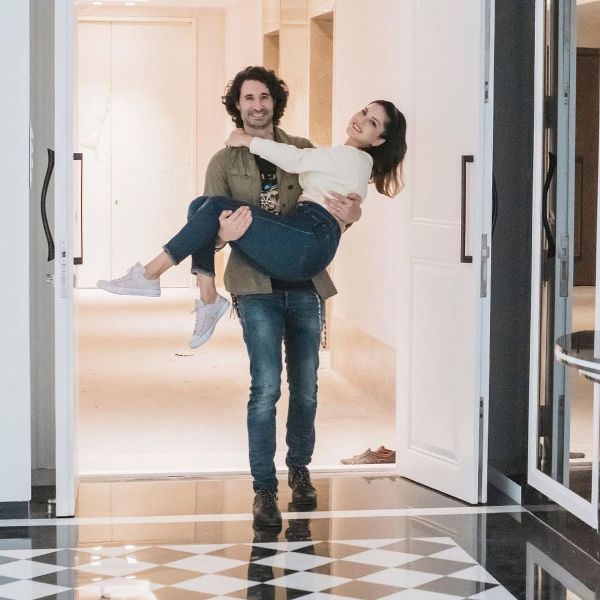 Daniel Weber carrying Sunny Leone in his arms as they happily enter their new house in Mumbai