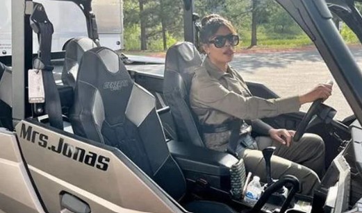 Priyanka Chopra sitting inside her ATV