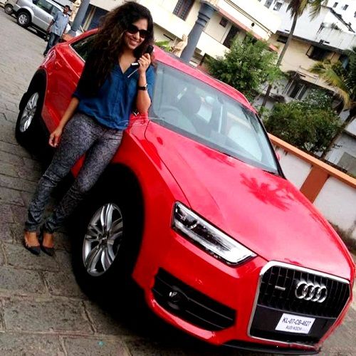 Ranjini Haridas poses with her car 'Audi Q3 Dynamic'