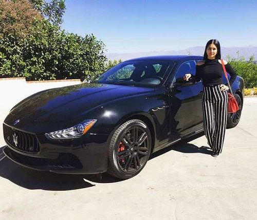 Sunny Leone poses with her Maserati Quattroporte car
