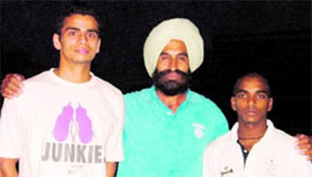 Arpinder Singh with his coach S. S Pannu in 2010