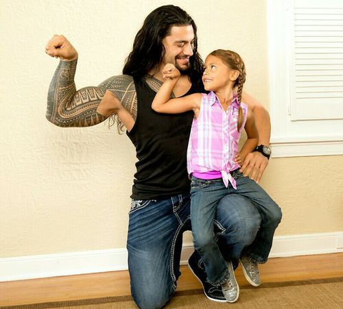 Roman Reigns with his daughter