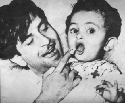 Baby Rishi Kapoor in the lap of his father Raj Kapoor