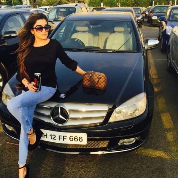 Tina Datta in front of her Mercedes-Benz C Class