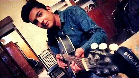 Mohammad Samad playing the guitar