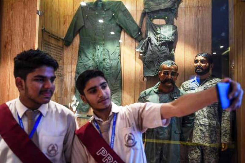 Students taking a selfie with the mannequin of Abhinandan Varthaman in Pakistan