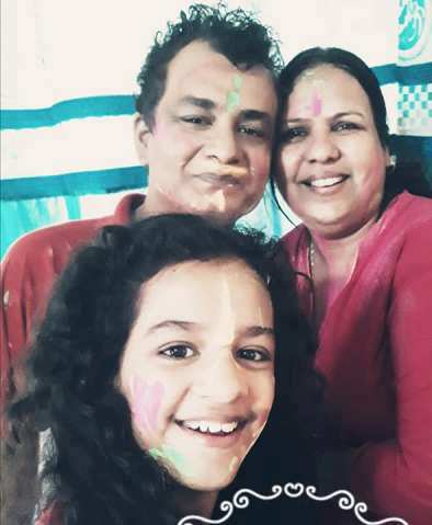 Syna Anand with her parents on holi