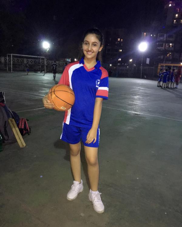 Ashnoor kaur posing with basketball