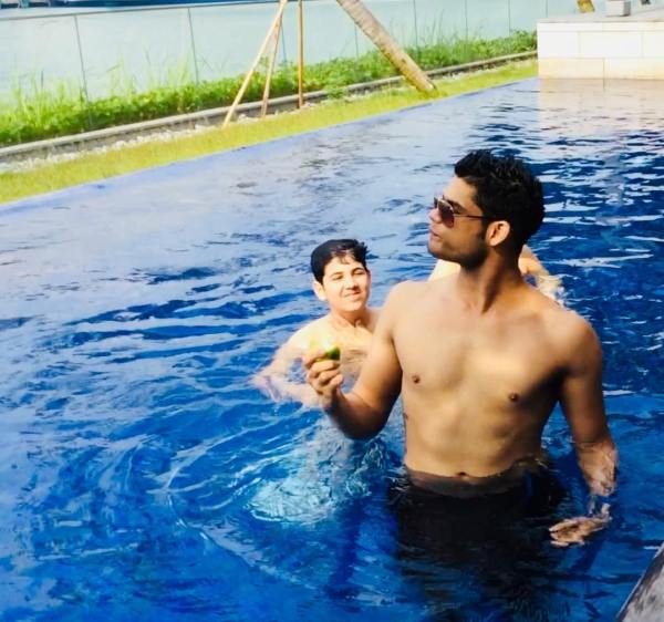 Karan Kapadia inside the pool with his nephew