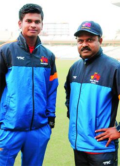 Shreyas Iyer with coach Pravin Amre