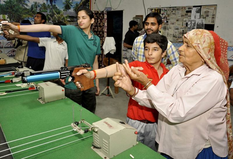 Chandro Tomar guiding youngsters for rifle shooting
