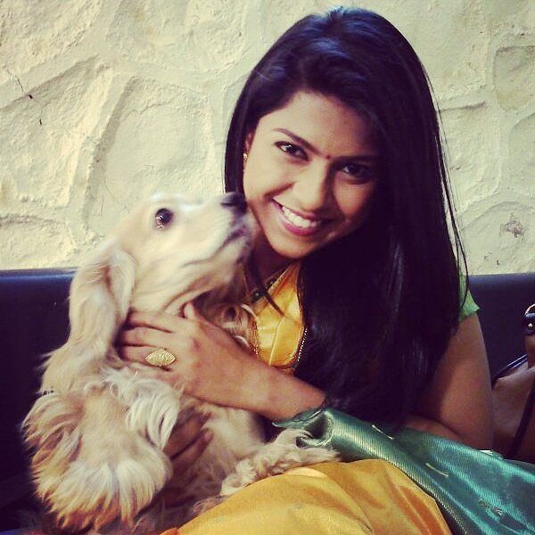Swarda Thigale with her pet dog