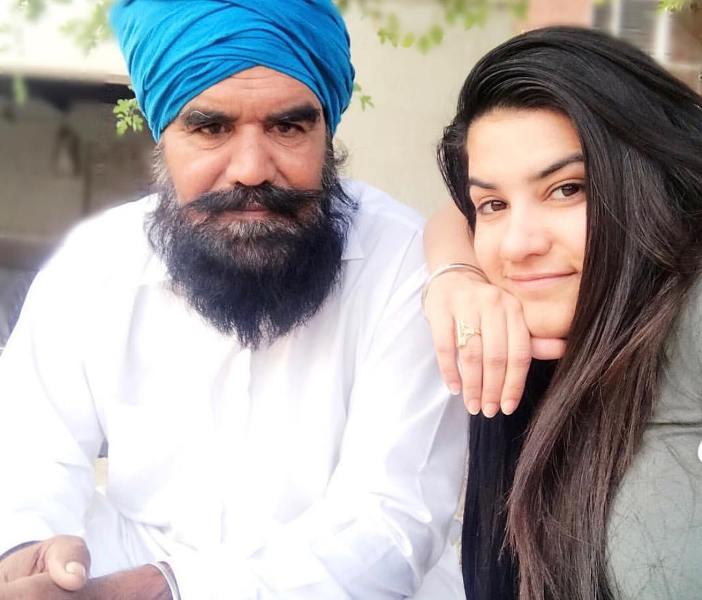 Kaur B with her father