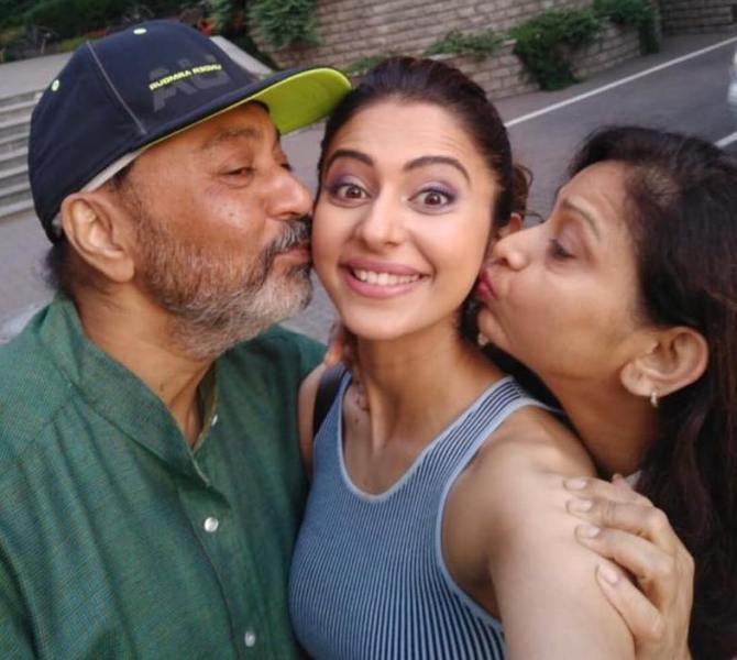 Rakul Preet Singh with her mother and father