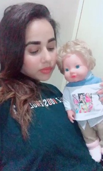 Sunanda Sharma with her doll