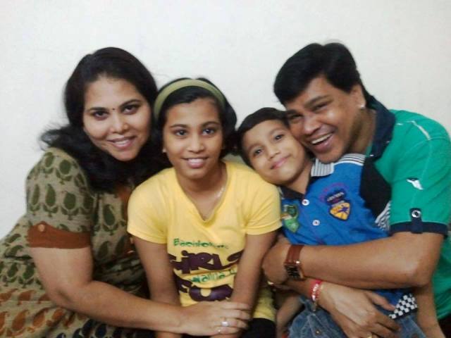 Digamber Naik with his wife and children