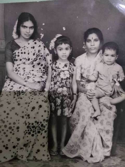 Fathima Babu (center) childhood photo
