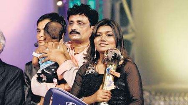 Vaishali Mhade with her husband and child
