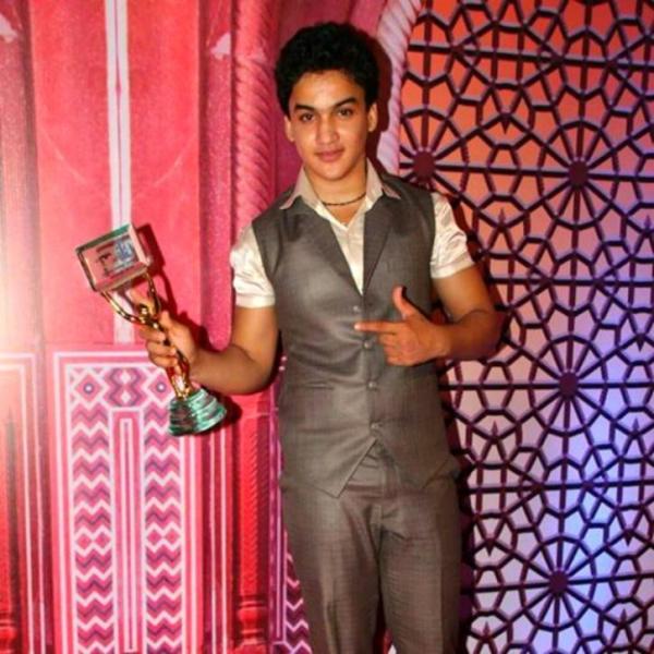 Faisal Khan with an award