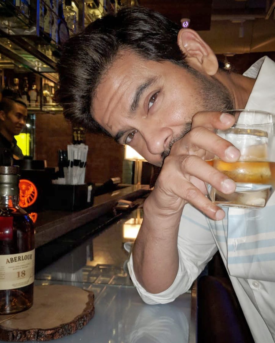 Keith Sequeira drinking alcoholic beverage