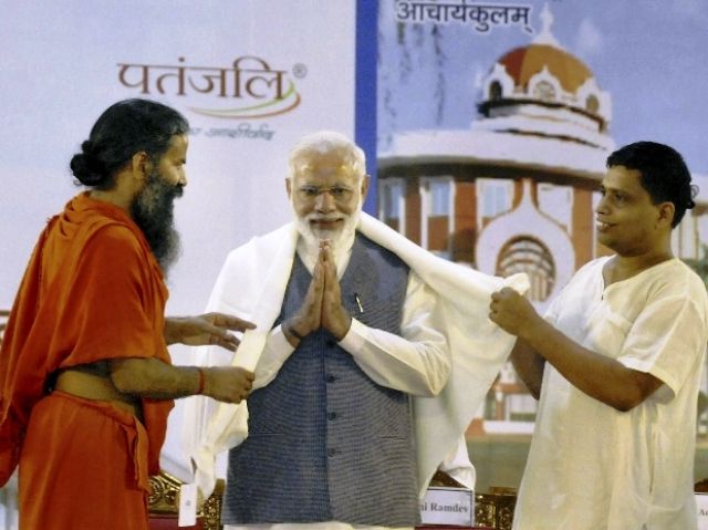 Acharya Balkrishna with Baba Ramdev and Narendra Modi