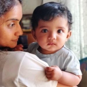 Amruta Subhash Posing With a Kid