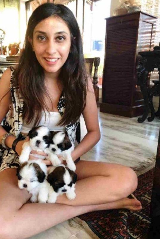 Anissa Malhotra with puppies