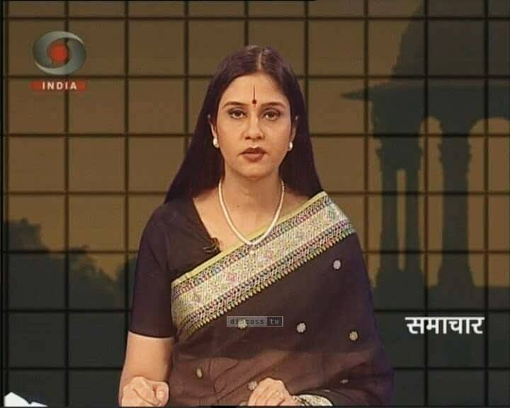 Neelum Sharma, anchoring a news show on DD INDIA