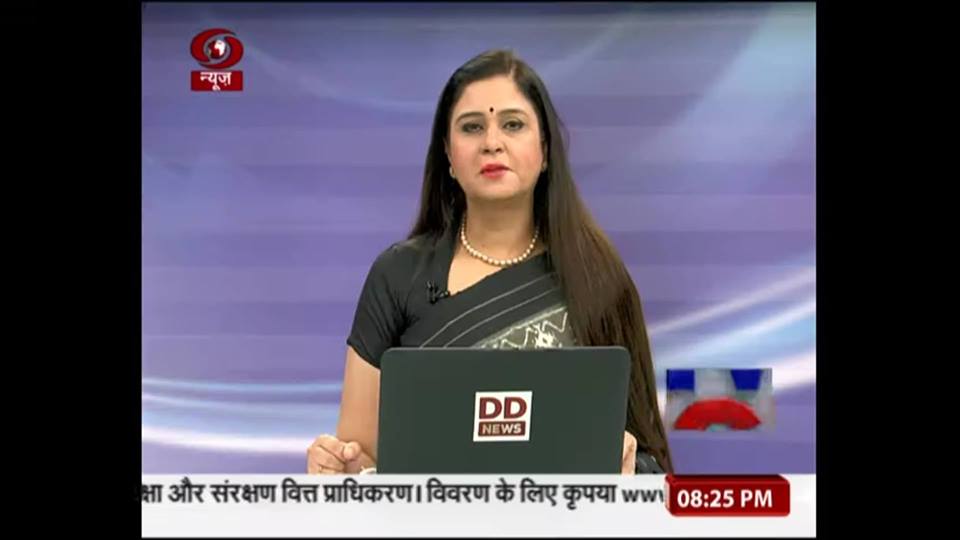 Neelum Sharma, anchoring a news show on DD News