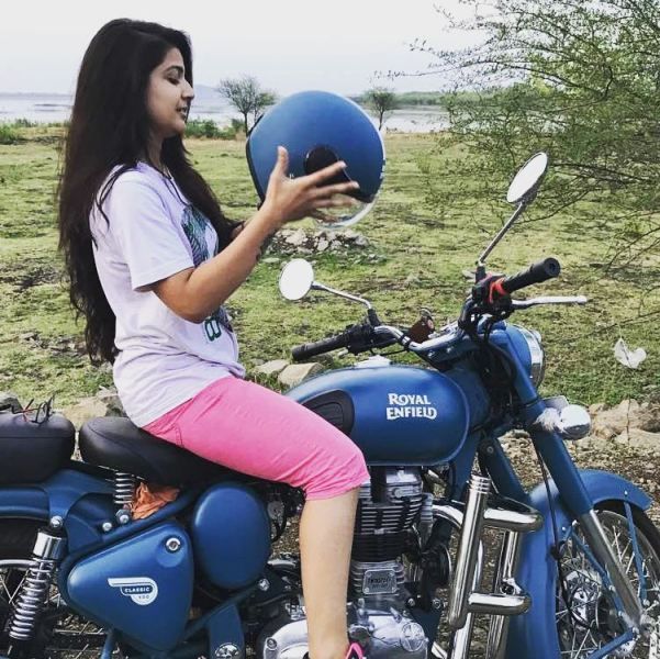 Starnick posing with her Royal Enfield