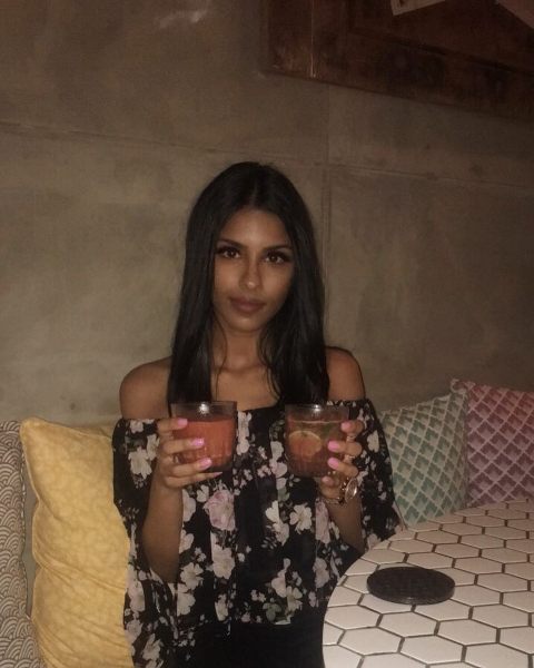 Vini Raman enjoying cocktail in a party