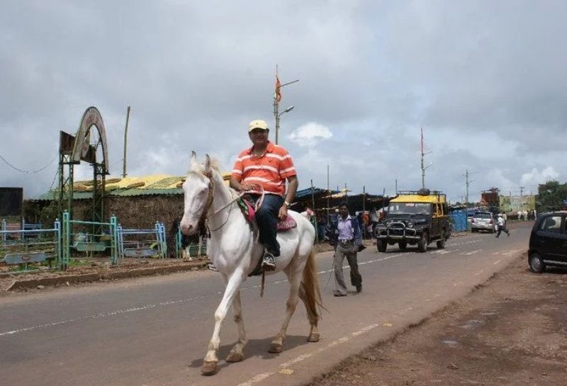 Abu Malik riding a horse