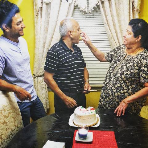Kenny Sebastian with his parents