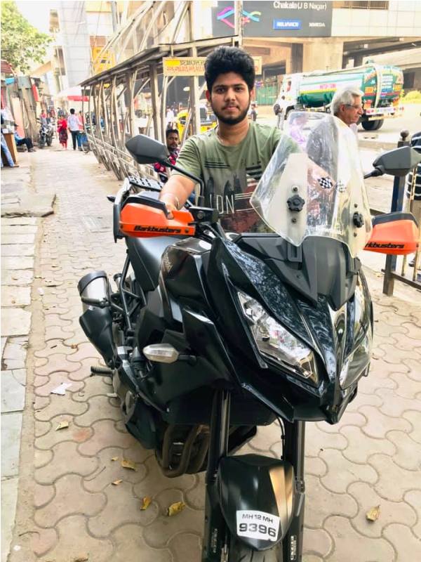 Adriz Ghosh Posing with His Motorcycle