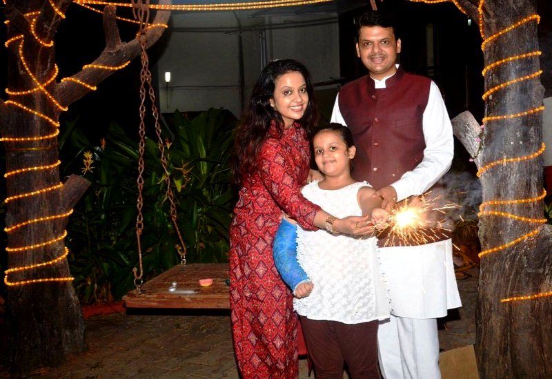 Devendra Fadnavis with his wife Amruta Fadnavis and his daughter Divija Fadnavis