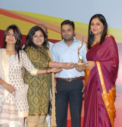 Richa Anirudh being felicitated with an award