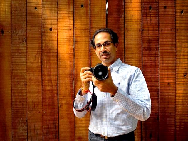 Uddhav Thackeray posing with a camera