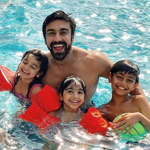 Ashish Chowdhry swimming with his kids