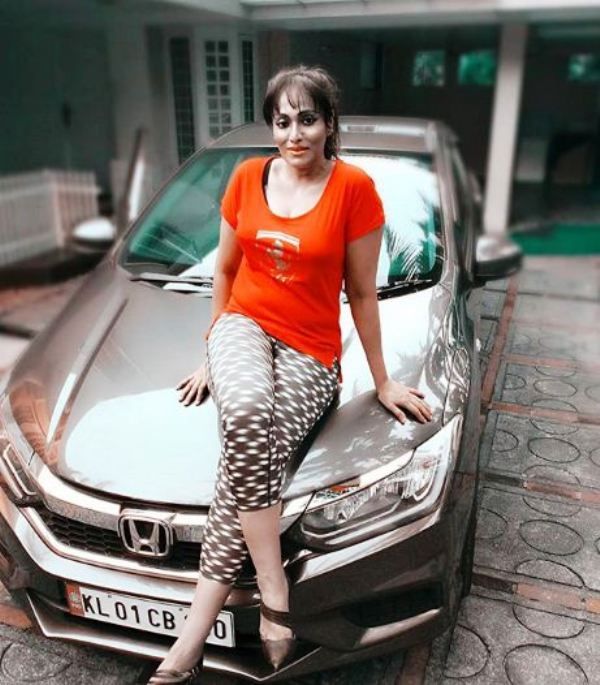 Jagee John with Her Car