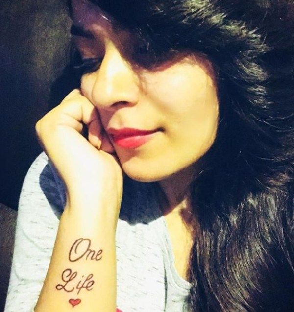 Nidhi Jha posing with her Tattoo