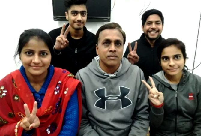 Priyam Garg's father Naresh Garg (centre) and his siblings