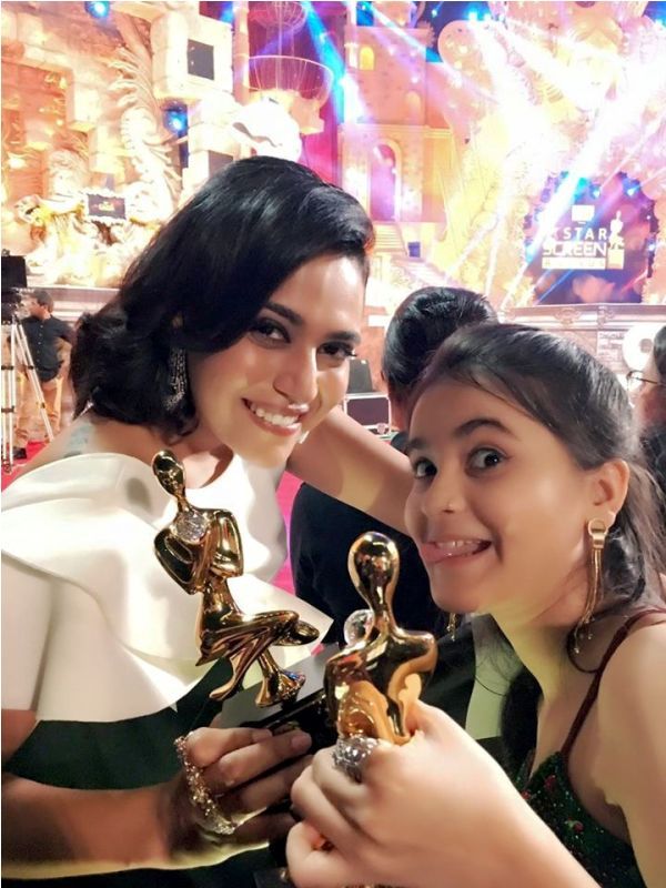 Riya Shukla Posing with Her Award