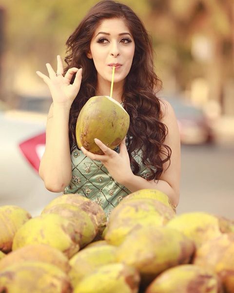 Garima Jain having Coconut Water